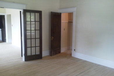 Inspiration for a timeless light wood floor home office remodel in Other with beige walls