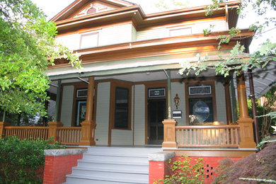 Example of a classic green two-story wood exterior home design in Atlanta