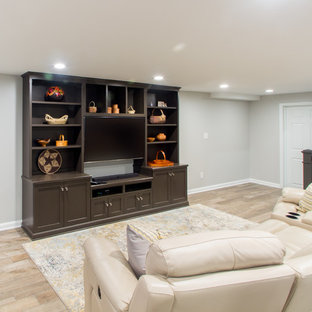 Home theater - mid-sized craftsman open concept porcelain floor and beige floor home theater idea in Louisville with gray walls and a media wall