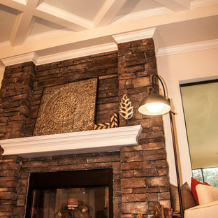Inspiration for a large timeless open concept medium tone wood floor family room remodel in Tampa with a brick fireplace, beige walls and a standard fireplace