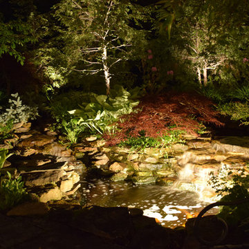 Outdoor fireplace, fire pit, outdoor kitchen and stone lighting in New Jersey