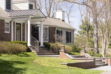 Example of a mid-sized classic multicolored one-story brick gable roof design in Orange County