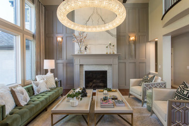 Large transitional medium tone wood floor living room photo in Denver with a standard fireplace and a stone fireplace