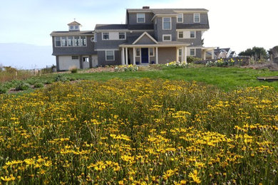 Home design - large coastal home design idea in Providence