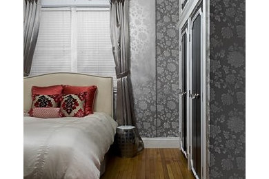 Example of a mid-sized classic master light wood floor bedroom design in Boston with gray walls and no fireplace