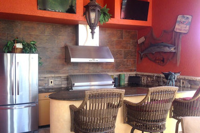 Inspiration for a mid-sized transitional backyard patio kitchen remodel in Miami