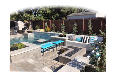 Mid-sized trendy backyard concrete paver patio photo in Los Angeles with a fire pit