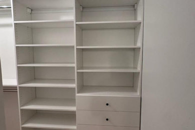 Example of a transitional closet design in New York