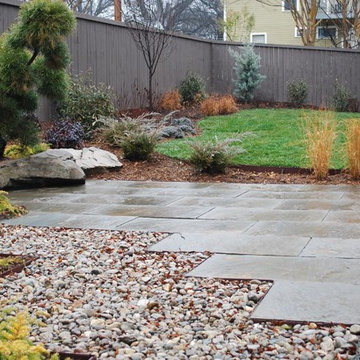 Zigzag patio with cut in boulders.