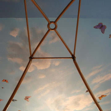 Sky Ceiling Mural with Butterflies, hand-painted in a bedroom by Mural Art LLC.