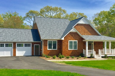Mid-sized arts and crafts beige one-story wood exterior home photo in Providence with a shingle roof