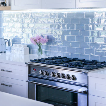 Beach-Style Kitchen with Blue Tiles