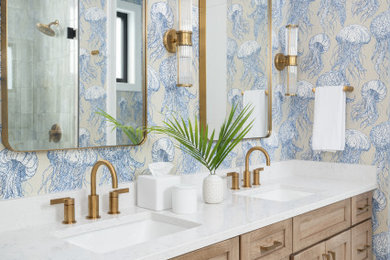 Transitional white floor, double-sink and wallpaper bathroom photo in Baltimore with shaker cabinets, medium tone wood cabinets, multicolored walls, an undermount sink, white countertops and a built-in vanity