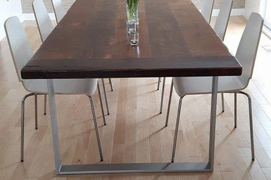 Example of a mid-sized transitional light wood floor enclosed dining room design in San Diego with gray walls and no fireplace