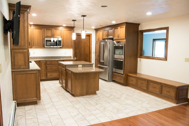 Inspiration for a mid-sized transitional u-shaped porcelain tile and beige floor kitchen remodel in Other with an undermount sink, recessed-panel cabinets, medium tone wood cabinets, granite countertops, stainless steel appliances and an island