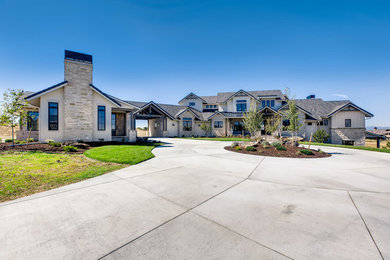 Inspiration for a large farmhouse white house exterior remodel in Denver with a tile roof