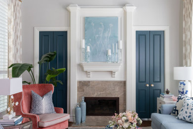 Inspiration for a large timeless formal and enclosed medium tone wood floor and brown floor living room remodel in Dallas with a stone fireplace, gray walls, a two-sided fireplace and no tv