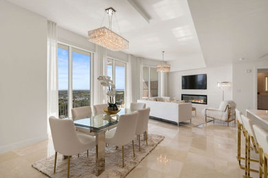 Inspiration for a mid-sized contemporary open concept porcelain tile and beige floor family room remodel in Tampa with white walls and a media wall