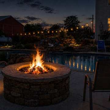 Luxury Backyard Fire Pit Design with Poolside Night Ambience
