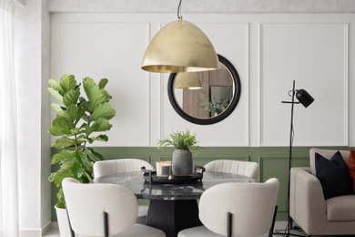 Inspiration for a contemporary wall paneling dining room remodel in Other