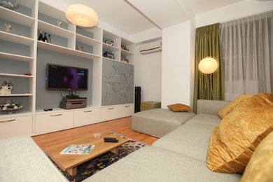 Living room - mid-sized contemporary living room idea in London with a wall-mounted tv