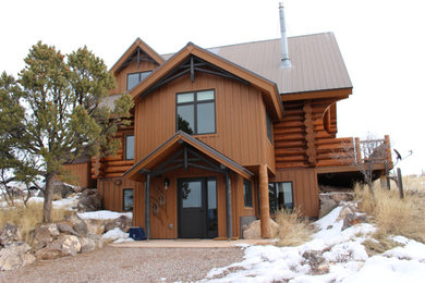 Example of a mountain style home design design in Denver