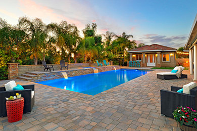 Example of a huge transitional backyard stone and rectangular pool fountain design in Los Angeles