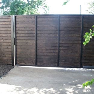 Mid-sized traditional backyard partial sun driveway in Houston with a garden path and concrete pavers for spring.