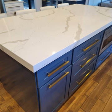 Modern kitchen design and remodel. Shaker style cabinets in white and blue.