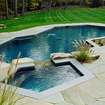Contemporary Free Form Pool with Spa and Waterfall Features