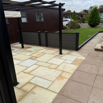 Pergola and Sandstone Patio Seen From the Lodge Drive