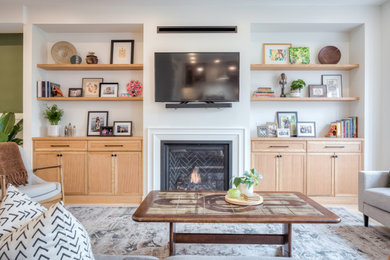Inspiration for a mid-sized scandinavian open concept light wood floor and beige floor living room remodel in Toronto with white walls, a standard fireplace and a wood fireplace surround