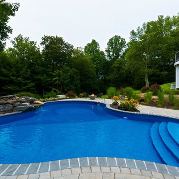 Vinyl pool with Waterfall, Landscape Lighting and Landscaping