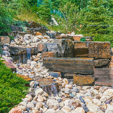Waterfall Water Feature With River Rock & Kootenay Brown Stone