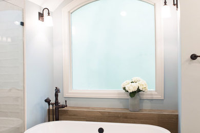 Example of a farmhouse bathroom design in Charlotte