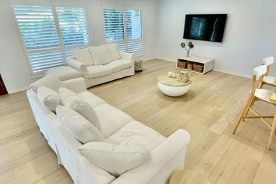 This is an example of a mid-sized modern enclosed living room in Gold Coast - Tweed.