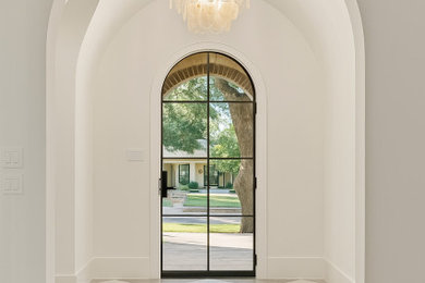 Entryway - traditional ceramic tile, gray floor and vaulted ceiling entryway idea in Dallas with white walls and a black front door