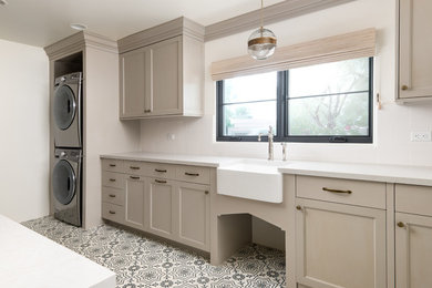 Inspiration for a mediterranean laundry room remodel in Phoenix