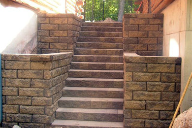 Photo of a rustic hillside concrete paver retaining wall landscape in Other.