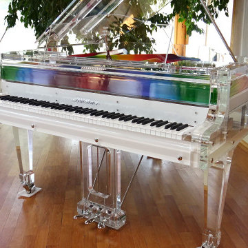 Lucid iDyllic fully transparent baby grand piano with custom rainbow plate