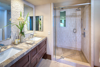 Example of a mid-sized trendy 3/4 beige tile and stone tile travertine floor alcove shower design in Orange County with an undermount sink, shaker cabinets, medium tone wood cabinets and beige walls