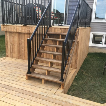 Multiple levels deck with a storage space and a hut-tub place