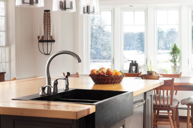 Farmhouse home design photo in Boston