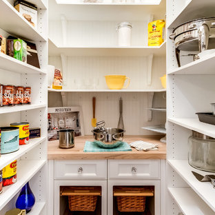 Farmhouse kitchen pantry designs - Kitchen pantry - cottage kitchen pantry idea in Montreal with open cabinets, white cabinets and wood countertops