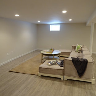 Photo of a small fully buried basement in New York with white walls, lino flooring and beige floors.