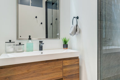 Inspiration for a modern master gray tile and cement tile single-sink doorless shower remodel in Toronto with flat-panel cabinets, dark wood cabinets, a hinged shower door and a floating vanity