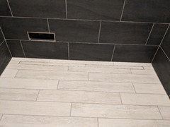 Bathroom with charcoal gray slate tiles and white grout?