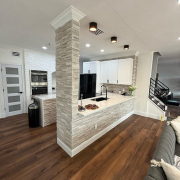 **Complete Kitchen, Flooring, Complete Stair Case and Trim