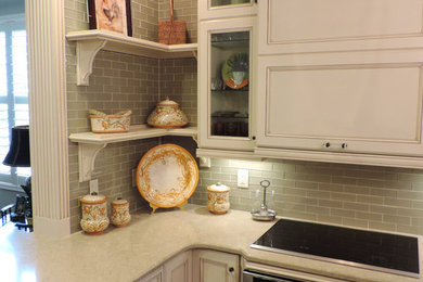 Mid-sized cottage dark wood floor and brown floor open concept kitchen photo in Miami with recessed-panel cabinets, white cabinets, glass tile backsplash, stainless steel appliances, an undermount sink, gray backsplash and a peninsula