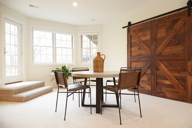 Basement - large transitional walk-out carpeted and beige floor basement idea in Chicago with beige walls and a standard fireplace